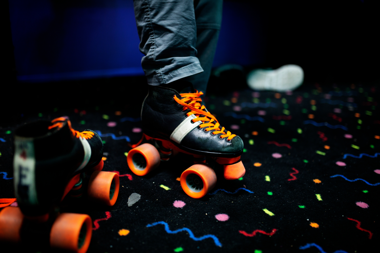boy-putting-on-roller-skates-at-a-roller-rink-2021-08-29-23-54-00-utc_med